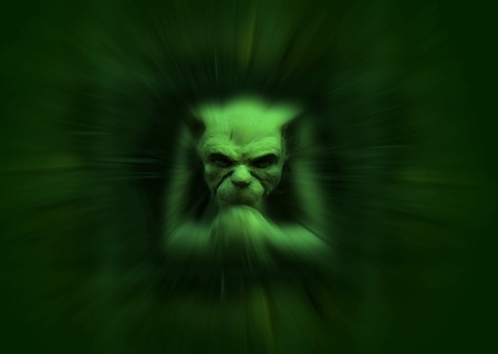 Stone carved gremlin figure with zoom effect in greenの写真素材