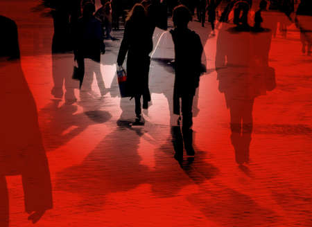 Multi layered image of shoppers in city centerの写真素材