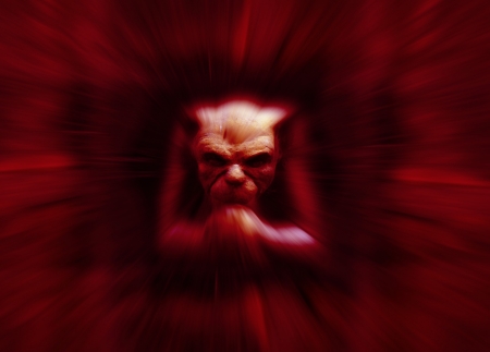 Stone carved gremlin figure with zoom effect in redの写真素材