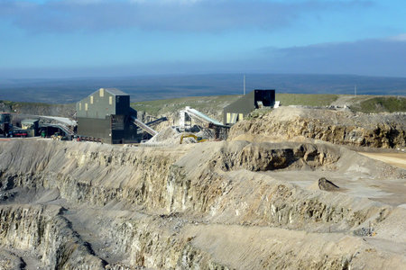 View of stone quarry showing mining equipment.