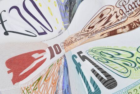English banknotes distorted to signify UK financial problemsの写真素材