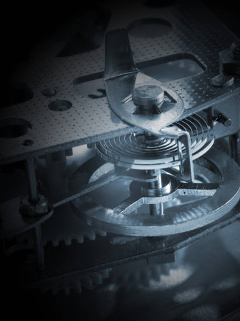 Closeup of cogs and spring inside of a clockwork timer