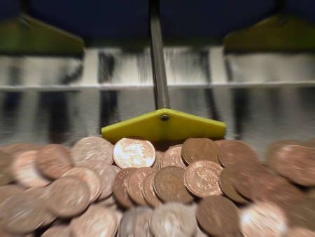 Image showing coins inside of a slot machine with zoom effectの写真素材