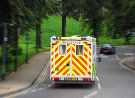View of ambulance reacting to 999 call  Zoom blur added for effect 