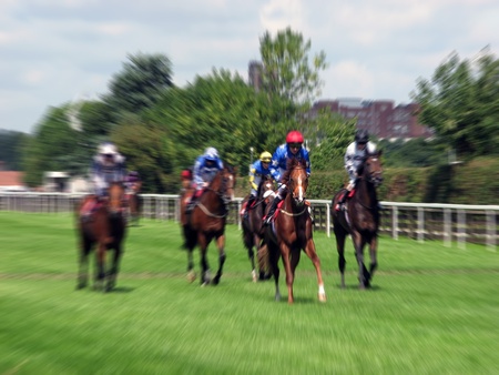 Zoom effect applied to horses running at York Race Course の写真素材
