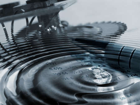 Concept illustration showing clockwork parts with water ripples overlaid with currency figures の写真素材