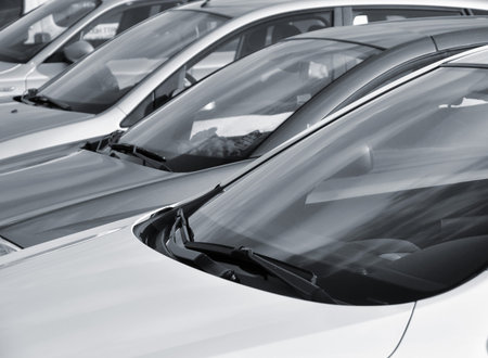 Telephoto view of vehicles parked in parking lot