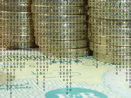 Closeup of British currency overlaid with ones and zeros 