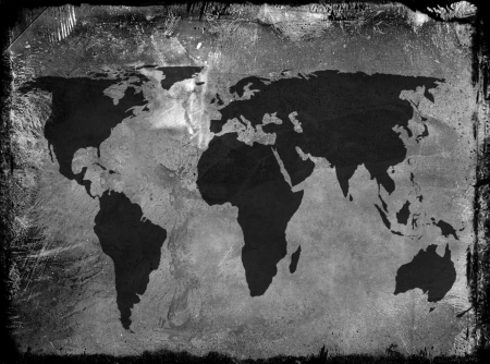 Outline map of world overlaid over grunge type backgroundの写真素材