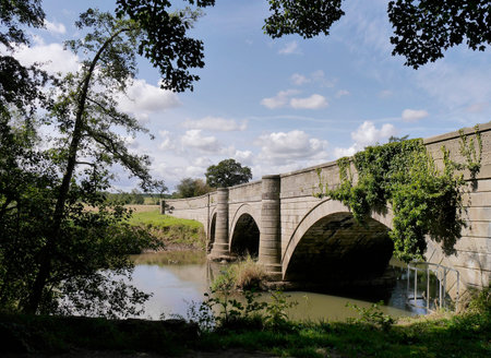 View of road bridge which crosses the River Derwent near Howsham Mill, North Yorkshire.の写真素材
