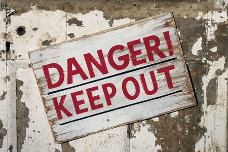 Closeup of weathered Danger Keep Out signの写真素材