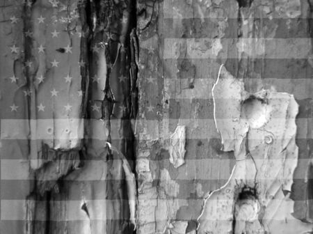 Grunge image showing the USA flag overlaid over flaky paint on old wooded doorのeditorial素材