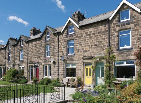Row of English terraced houses with front gardensの写真素材