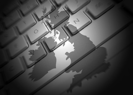 Closeup of laptop keyboard overlaid with UK mapの写真素材