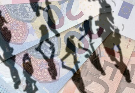 Shadows of people walking are overlaid onto European Euro banknotes.の写真素材