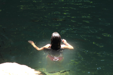 Tourist woman bathing on a tropical  on holidaysの写真素材