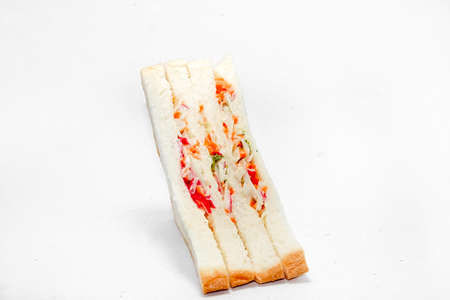 Healthy ham sandwich with cheese, tomato - lettuce - corn - carrot on white background.の写真素材