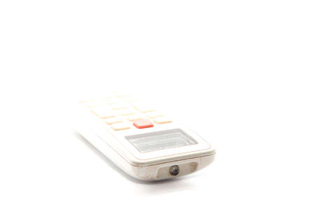 dusty air conditioner remote on a white background using a flash for clarity in my home studio.の写真素材