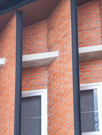 red brick construction is a modern, classic building with ventilation and heat windows.の写真素材