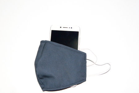 Mask and telephone, ready to protect and cope. Covid-19 on a white background