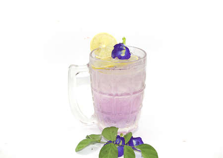 Butterfly Pea juice or Purple Butterfly Pea flower tea mixed with lemon juice on white background.の写真素材