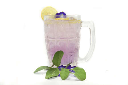 Butterfly Pea juice or Purple Butterfly Pea flower tea mixed with lemon juice on white background.の写真素材
