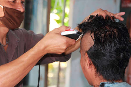 Thai men shave their hair for the ordination of monks - to replace the grace of parents in Thailand's Buddhism - 2- 2015-Nakhon Pathom, Thailand.のeditorial素材