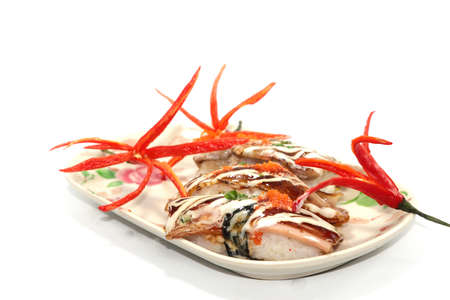 Healthy Home Cooking - Grilled pork sushi placed on a white plate, is a Japanese style Thai food on a white background and is sold at Thailand and every festival.の写真素材
