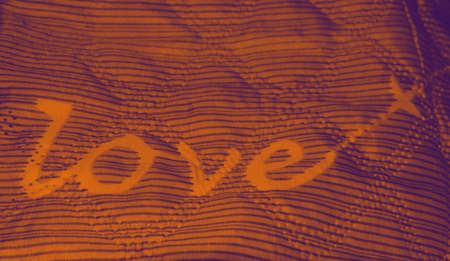 Warm blankets or bed linen - word love - given as a gift on Christmas and New Years in winter to warm and start a new era of people around the world.の写真素材