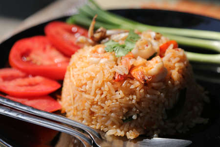 Chili Paste Fried Rice Tom Yum - Squid and Shrimp - with spicy flavor is a healthy food that contains many kinds of herbs - Thai food.の写真素材