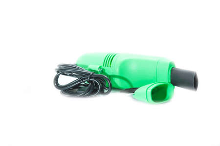 Mini portable cordless vacuum and cleaner for cleaning keyboards and cell phones and many other small devices is a modern technology.の写真素材