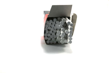 White chalk for writing on a blackboard is a symbol of school teachers and for restaurants writing classic retro menus - on a white background.の写真素材