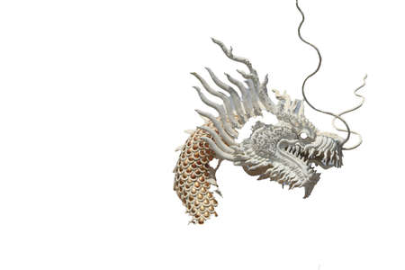 white stucco dragon is a delicate sculpture and art created by the Chinese as a mythical creature or in Chinese literature on a white background.の写真素材