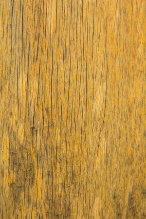 pattern of the old wooden plank is yellow hardwood, natural wood used to decorate the house to be beautiful and protect against robbers and criminals.の写真素材
