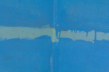 light blue plaster wall is quite old. In my bedroom it looks unattractive and the paint peels off over time and waits for repairs to repaint it to be as bright as ever.の写真素材