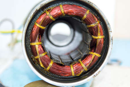 car dynamo is awaiting repair for reuse as a source of energy in the car. Is a circle surrounded by copper, a source of electric currentの写真素材