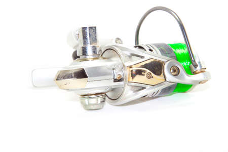 Fishing reels is a leisure sport or hobby of the unemployed, fishing is a popular thing for people to fish to eat and is a sport on a white background.の写真素材