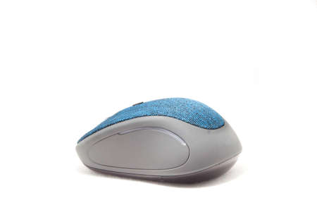 Beautifully shaped blue computer mouse with a modern and ergonomic design and ergonomics as a wireless mouse on a separate white background.の写真素材