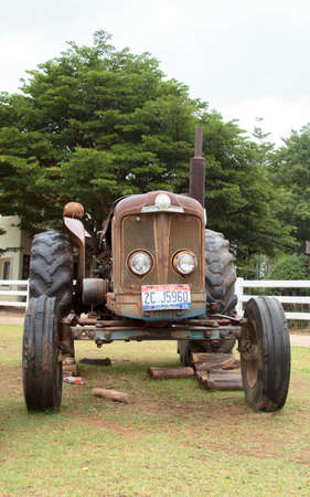 Antique tractors decorated in a beautiful garden in a tourist attraction that is a landmark for tourists to see-8-13-2014-Ratchaburi, Thailandのeditorial素材