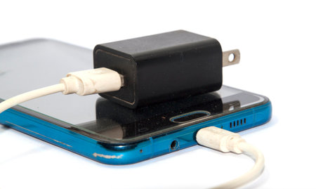 mobile charger Black and white on a white background It is modern equipment and technology. . Shot...