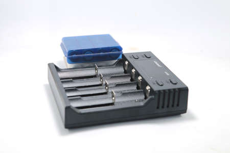 battery charger isolated on a white background Quick charge battery charger for AA AAA NiCD rechargeable batteries - in digital.の写真素材