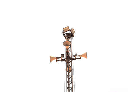 Broadcasting megaphones and lighting poles in the area are broadcast signals to keep people informed in tall poles with wire ropes fixed on a white background.の写真素材