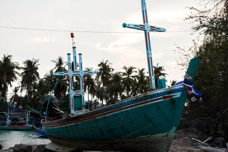 small fishing boat that catches fish and squid along the coast in a traditional way and maintains an ecosystem of fish and marine life for a long time on strong and windy days.の写真素材