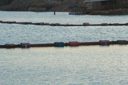 Suction boat's steel pipes are transporting sand from deep rivers for use in the construction of...