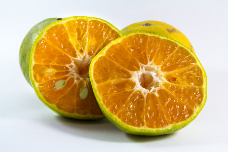 These are oranges and orange cut in half.の写真素材