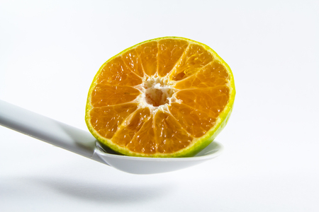 Orange is half a lap with a spoon.の写真素材