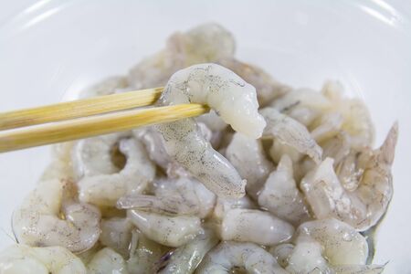 The shrimp was peeled cubed chopsticks.の写真素材