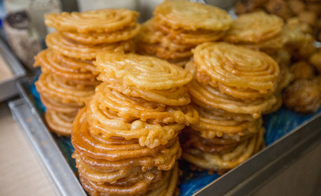 sweet zlabia piled in a plateの写真素材