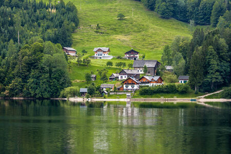 village on a hill near the lake, alps mountains, Austriaの写真素材