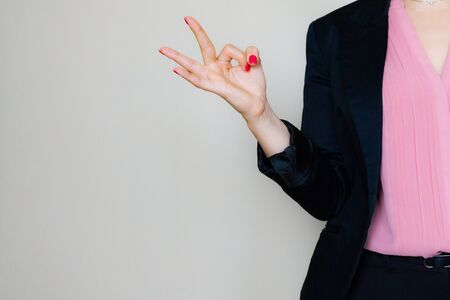 Perfect - business woman showing OK hand sign. businesswoman isolated on white background.の写真素材
